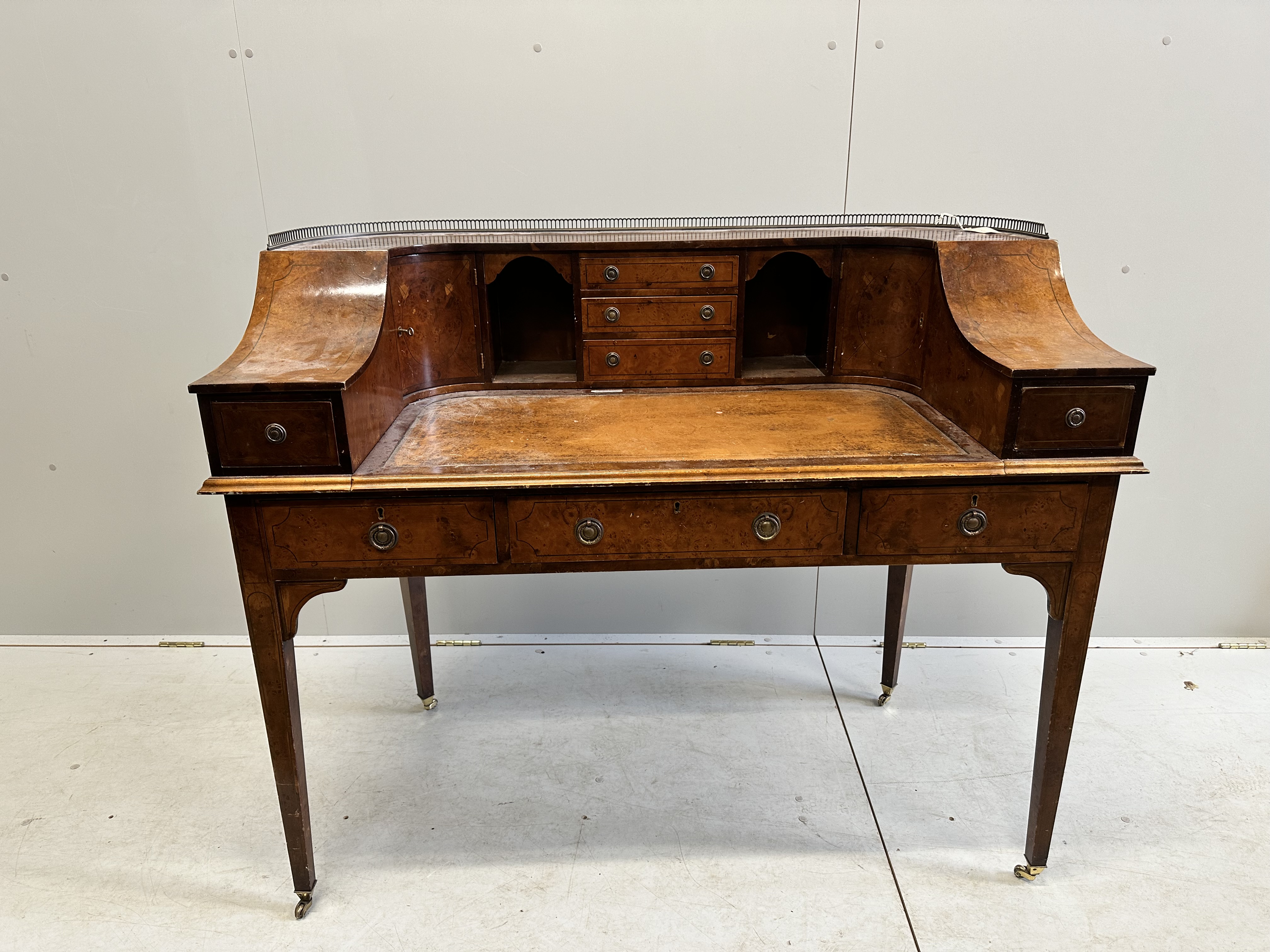 A reproduction yew Carlton House desk, width 123cm, depth 62cm, height 102cm